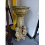 AN ANTIQUE COMPTON TYPE POTTERY PEDESTAL SUNDIAL DECORATED WITH FIGURES DEPICTING THE SEASONS.