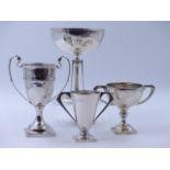 A GROUP OF THREE SILVER ENGRAVED PRESENTATION TROPHY CUPS, ONE BEARING A CHESTER HALLMARK, DATED