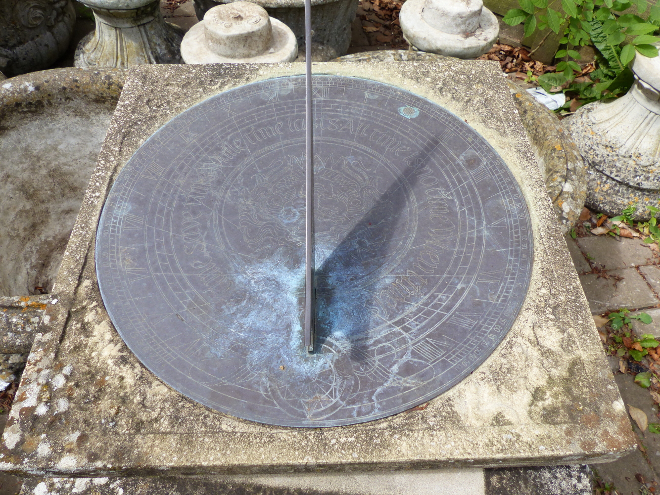 A GARDEN SUNDIAL ON COLUMN SUPPORT.