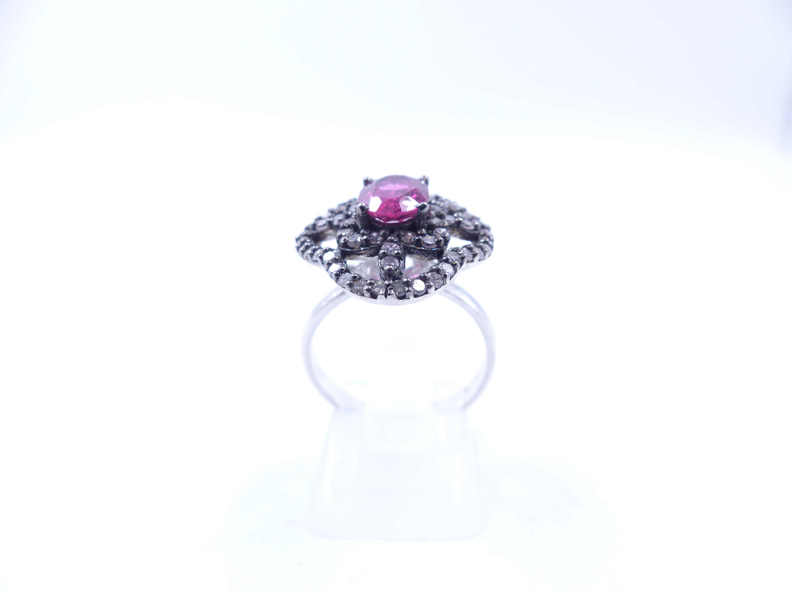 A PINK TOURMALINE AND DIAMOND OPEN WORK FILIGREE RING SET IN A WHITE METAL MOUNT,THE CENTRAL PINK - Image 15 of 17
