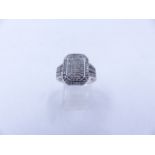 A 9ct WHITE GOLD DIAMOND PAVE SET RING. THE OCTAGONAL HEAD MEASURES 1.5cm X 1.1cm, WEIGHT 4.5grms,