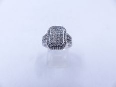 A 9ct WHITE GOLD DIAMOND PAVE SET RING. THE OCTAGONAL HEAD MEASURES 1.5cm X 1.1cm, WEIGHT 4.5grms,