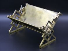 AN ARTS AND CRAFTS SILVER PLATED BRASS DESK BOOKSTAND, THE DESIGN ATTRIBUTED TO E.W.GODWIN. W.