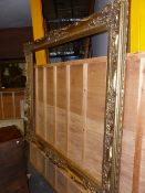 AN IMPRESSIVE GILT FRENCH STYLE FRAME. OVER ALL. 190 x 168cms. REBATE 160 x 124cms.