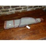 A PIGSKIN LEATHER LEG O'MUTTON GUN CASE TOGETHER WITH A CANVAS EXAMPLE. (2)