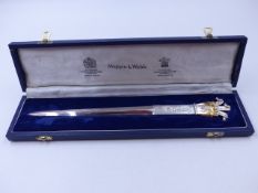 A SILVER ROYAL WEDDING COMMEMORATIVE CASED MAPPIN AND WEBB SPECIMEN HALLMARK LETTER OPENER TOPPED