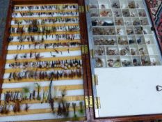 THREE LARGE MAHOGANY BOXES CONTAINING A GOOD SELECTION OF HAND TIED FISHING FLIES.