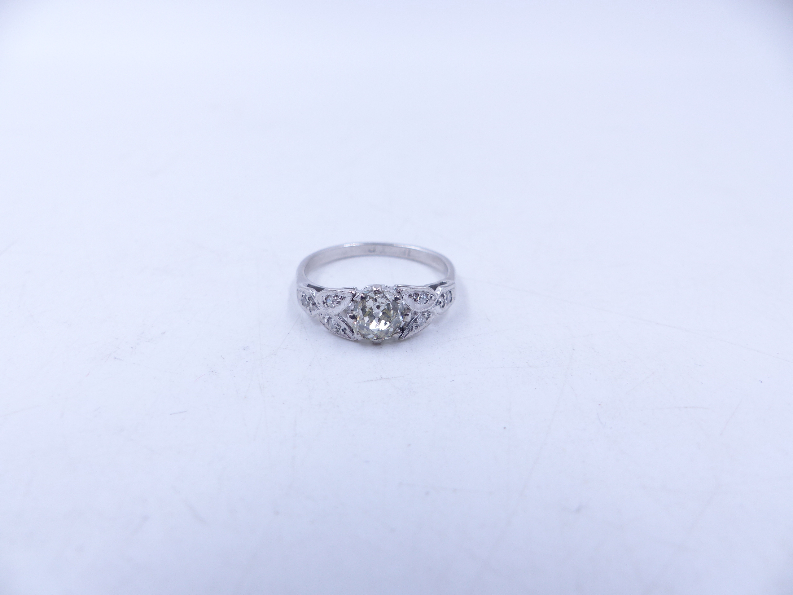 AN 18ct STAMPED OLD CUT DIAMOND RING. THE CENTRAL OLD CUT DIAMOND IS HELD IN AN EIGHT CLAW SETTING - Image 11 of 14