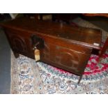 A SMALL 17th.C.OAK PLANK COFFER WITH SIMPLE CARVED DECORATION TO FRONT WITH PERIOD LOCK AND KEY. W.