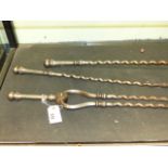 A SET OF THREE EARLY 19th.C.STEEL FIRESIDE IMPLEMENTS WITH TWIST SHAFTS, THE POKER L.73cms.