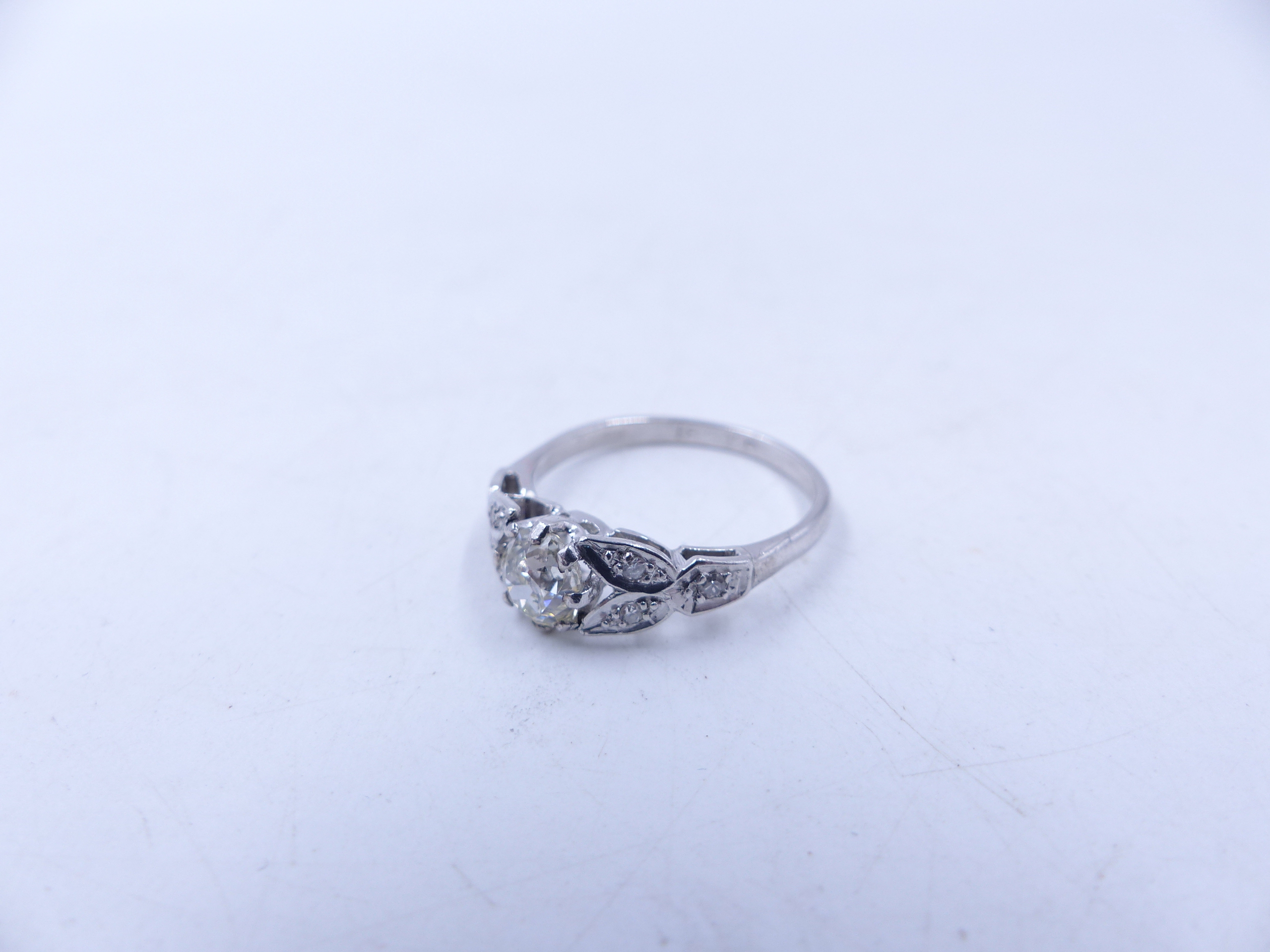 AN 18ct STAMPED OLD CUT DIAMOND RING. THE CENTRAL OLD CUT DIAMOND IS HELD IN AN EIGHT CLAW SETTING - Image 13 of 14