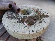 A LARGE MILLSTONE WITH IRON CENTRE. Dia.109cms.