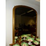 A LARGE VICTORIAN GILT FRAMED OVERMANTLE MIRROR. W.111 x H.135cms.
