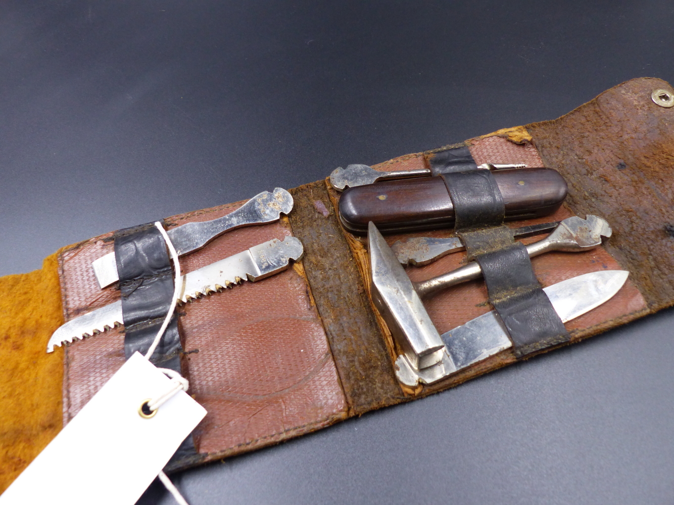 A BONZA TYPE LEATHER CASED TOOL KIT CONTAINING VARIOUS TOOLS AND IMPLEMENTS. - Image 2 of 9