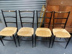 A SET OF TEN GIO PONTI DESIGN EBONISED LADDER BACK RUSH SEAT SIDE CHAIRS.