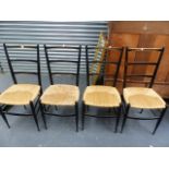 A SET OF TEN GIO PONTI DESIGN EBONISED LADDER BACK RUSH SEAT SIDE CHAIRS.