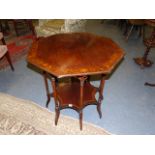 A LATE 19th/20th.C. OCTAGONAL CENTRE TABLE ON TURNED COLUMN SUPPORTS WITH UNDER TIER IN THE ARTS AND