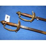 A PAIR OF 19th.C.CONTINENTAL RAPIERS WITH BRASS GUARDS AND WOOD HANDLES.