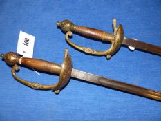 A PAIR OF 19th.C.CONTINENTAL RAPIERS WITH BRASS GUARDS AND WOOD HANDLES.