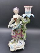 A 19th.C. FIGURATIVE CANDLESTICK EMBLEMATIC OF SUMMER IN THE DERBY MANNER. H. 27cms.