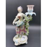 A 19th.C. FIGURATIVE CANDLESTICK EMBLEMATIC OF SUMMER IN THE DERBY MANNER. H. 27cms.