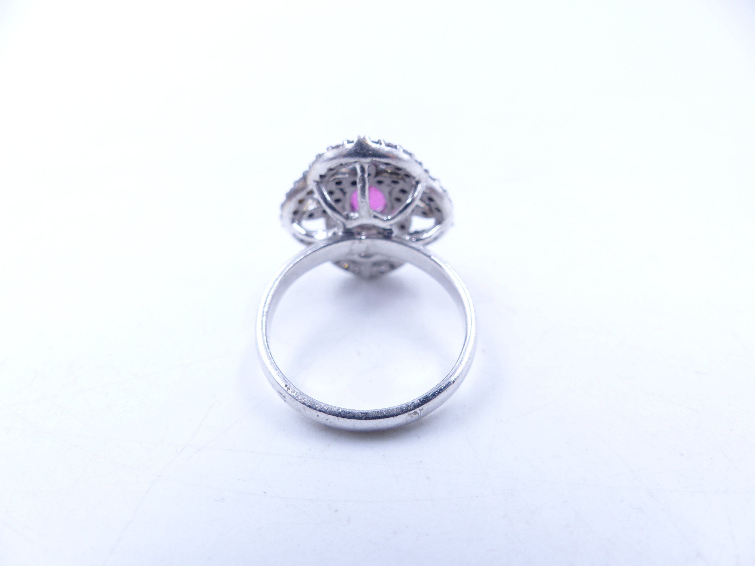 A PINK TOURMALINE AND DIAMOND OPEN WORK FILIGREE RING SET IN A WHITE METAL MOUNT,THE CENTRAL PINK - Image 6 of 17