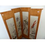 AN ART DECO SATIN WALNUT TWO FOLD SCREEN INSET WITH ORIENTAL SILK EMBROIDERED PANELS.