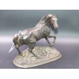 AN ANTIQUE WELL MODELLED FIGURE OF A STALLION ON A NATURALISTIC PLINTH BASE.