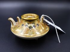 A MINIATURE JAPANESE SATSUMA TEAPOT WITH FIGURAL DECORATION SIGNED WITH CHARACTERS TO BASE. H.5cms.