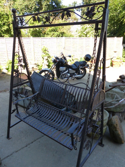 A METAL GARDEN SWING SEAT. W.156cms.