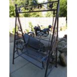 A METAL GARDEN SWING SEAT. W.156cms.