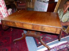 AN EARLY 19th.C.MAHOGANY SOFA TABLE ON SHAPED COLUMN SUPPORT AND SCROLL SABRE LEGS. W.107 x D.68 x