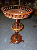 A VICTORIAN ROSEWOOD TWO TIER WINE TABLE.