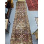 AN ANTIQUE PERSIAN TRIBAL RUNNER. 366 x 92cms.