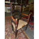 AN 18th.C.COUNTRY LADDER BACK SIDE CHAIR WITH RUSH SEAT.