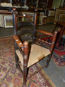 AN 18th.C.COUNTRY LADDER BACK SIDE CHAIR WITH RUSH SEAT.