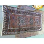 AN ANTIQUE AFGHAN ENGSI RUG. 214 x 136cms. TOGETHER WITH A SMALLER ANTIQUE BELOUCH RUG.