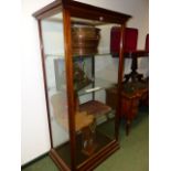A LARGE EARLY 20th.C.TALL GLAZED DISPLAY CABINET WITH GLASS SHELVES. H.193 x W.95 x D.65cms.