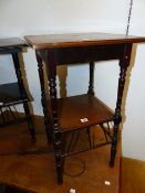 A LATE VICTORIAN ARTS AND CRAFTS MAHOGANY AND INLAID TWO TIER OCCASIONAL TABLE IN THE MANNER OF