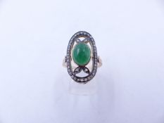 A YELLOW METAL (TESTS AS GOLD) DIAMOND AND CABOCHON GEMSTONE OVAL ELONGATED RING. FINGER SIZE O,