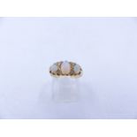 AN 18ct OPAL AND DIAMOND GRADUATED THREE STONE CLAW SET RING, DATED 1905, BIRMINGHAM. FINGER SIZE N,