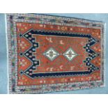 A PERSIAN RUG OF CAUCASIAN DESIGN. 148 x 112cms.