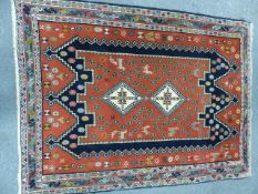 A PERSIAN RUG OF CAUCASIAN DESIGN. 148 x 112cms.