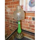 A LATE VICTORIAN CANDLE STAND WITH CAST BRASS BASE, GREEN GLASS STEM AND ETCHED GLASS SHADE LABELLED