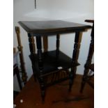 AN ARTS AND CRAFTS EBONISED TWO TIER OCCASIONAL TABLE IN THE MANNER OF GODWIN.
