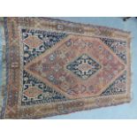 AN ANTIQUE PERSIAN QASHQAI RUG. 192 x 125cms.