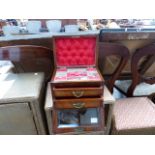 A MAHOGANY FITTED TRAVEL CASE WITH GLAZED PANEL.