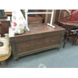 AN OAK BLANKET BOX.