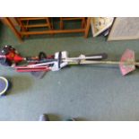 A PETROL STRIMMER, VARIOUS MULTI PURPOSE ATTACHMENTS.