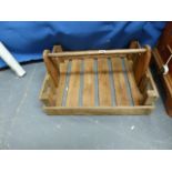 A VINTAGE FRUIT CRATE WITH CARRYING HANDLE.